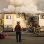 Firefighters arriving on the scene of the Sept. 25 3rd and Moore Fire. Photo: David Dodman, KNOM.