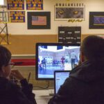 The BSSD Student Broadcast Team monitor their feed.