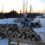 Steam rises from the barrels of water kept hot over fires for mushers on the Kobuk 440.