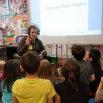 KNOM Volunteer Karen works with Nome Elementary students.