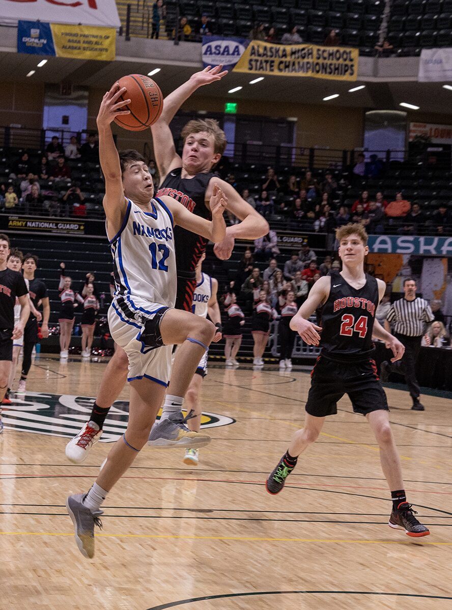 Nanook freshman Peyton Weyiouanna goes for a layup against Houston.