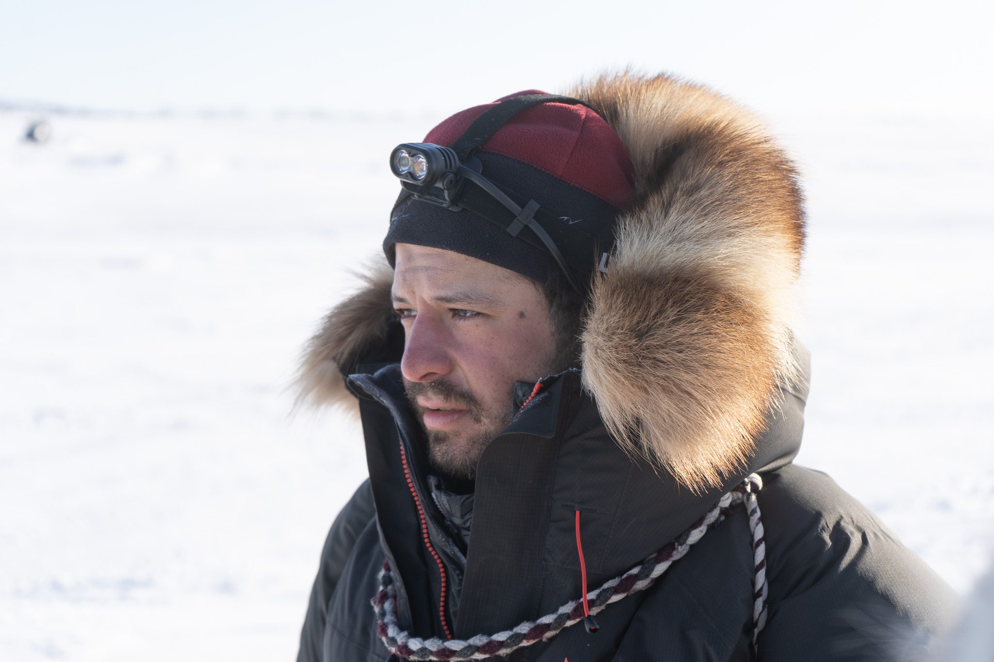 A man in a fur-ruffed parka