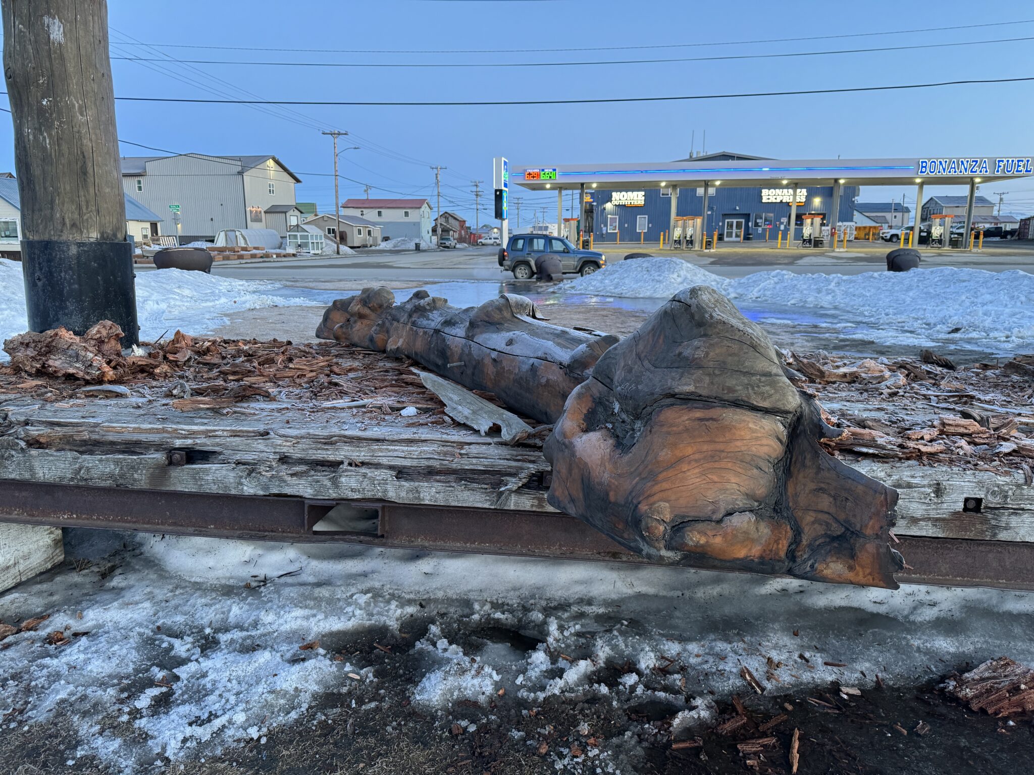 The beam that once spanned the two pillars lies on a wooden platform. Ben Townsend photo.