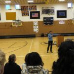 Sen. Lisa Murkowski speaks to students and community members at the Unalakleet School gym on Friday. Photo: Laura Kraegel, KNOM.