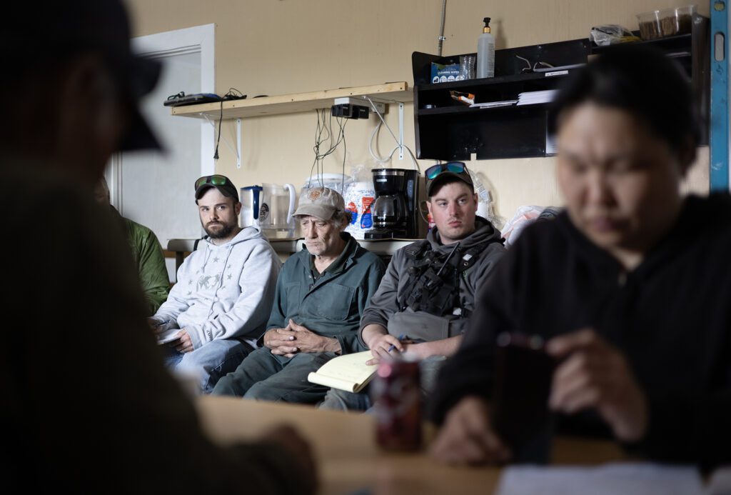 Dustin Scalisi, grey hoodie, sits in on a meeting held at the Tapraq Rock office. Ben Townsend photo.