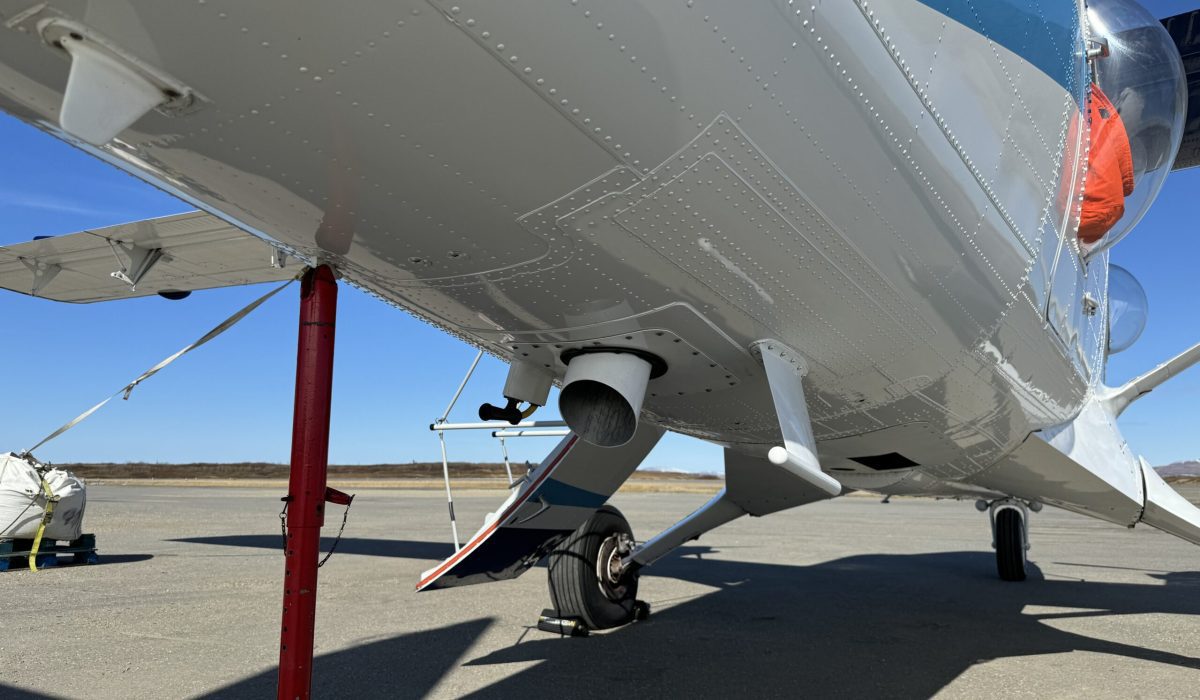 Buoys deployed by Michael Steele are dropped through a chute located at the back of NOAA's Twin Otter aircraft. Ben Townsend photo.