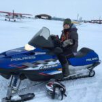 First time on a snow machine! (Photo: Andrea Irigoo)