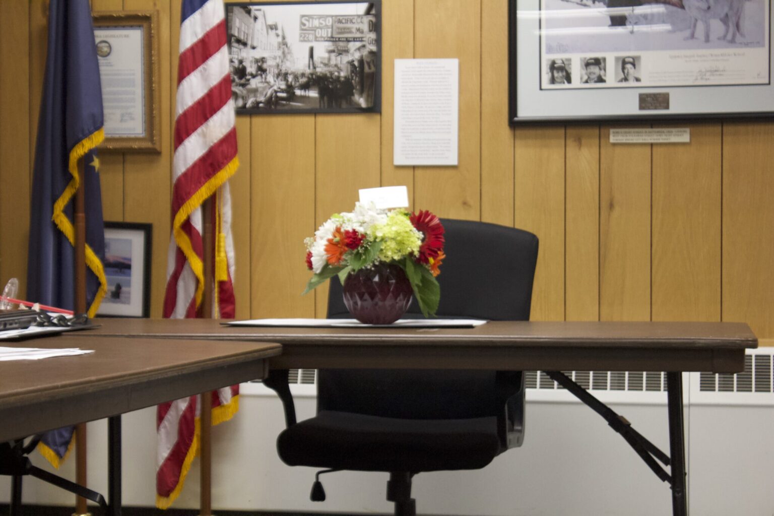 A bouquet of flowers mark the Mayor's seat in honor of the late Mayor Richard Beneville.