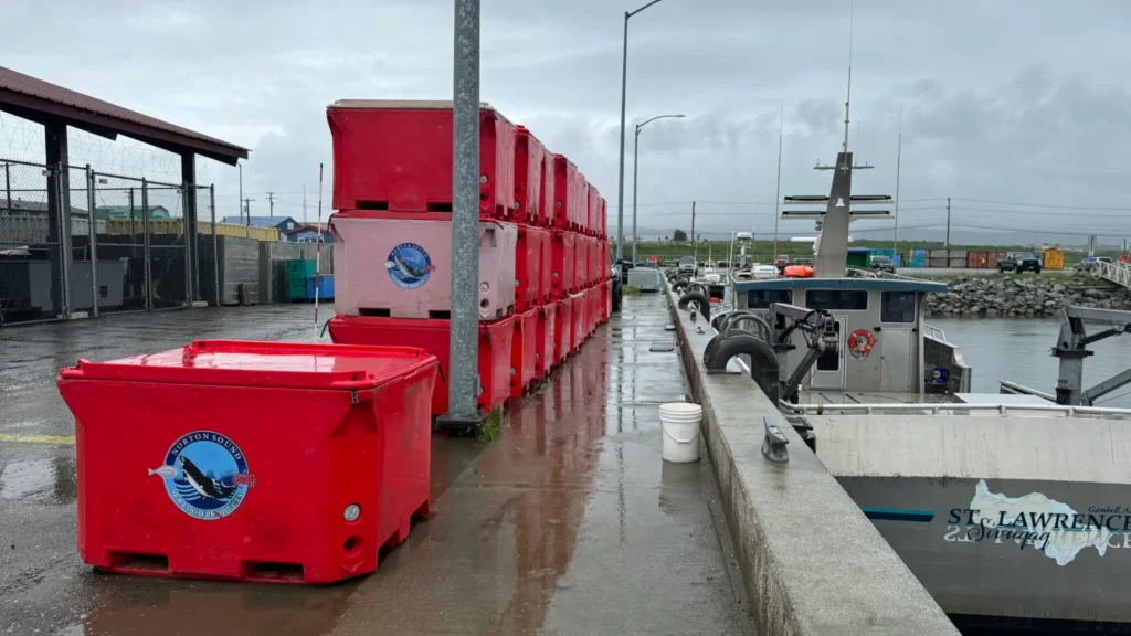 Red containers sit stacked near the Nome Harbor. Sarah Swartz photo.