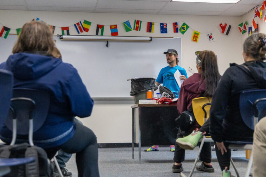 Emmett Foster shares his vision for the cross country team at a parent meeting on August 1. Ben Townsend photo.