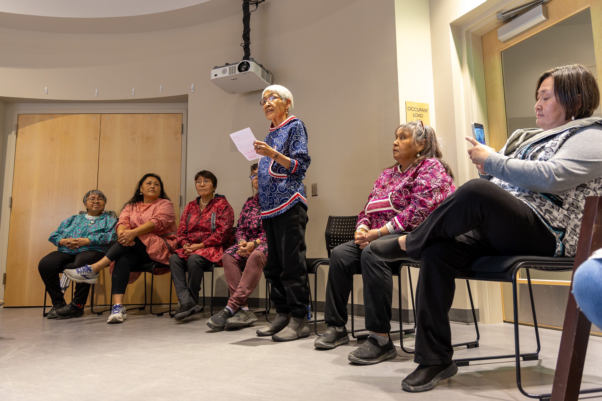 Maria Dexter reads a speech to a small crowd in Nome's Katirvik Culture Center. Ben Townsend photo. 