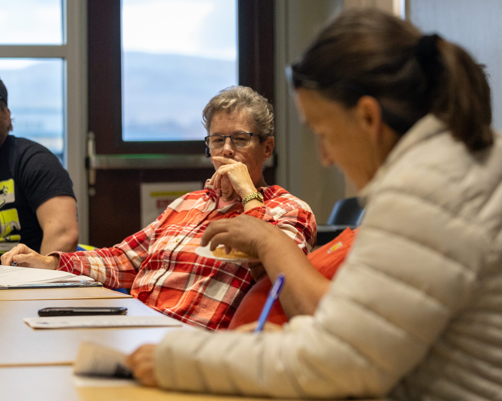 Joy Baker looks on as Commissioner Gay Sheffield takes notes at the September 19 Port Commission meeting. Ben Townsend photo. 