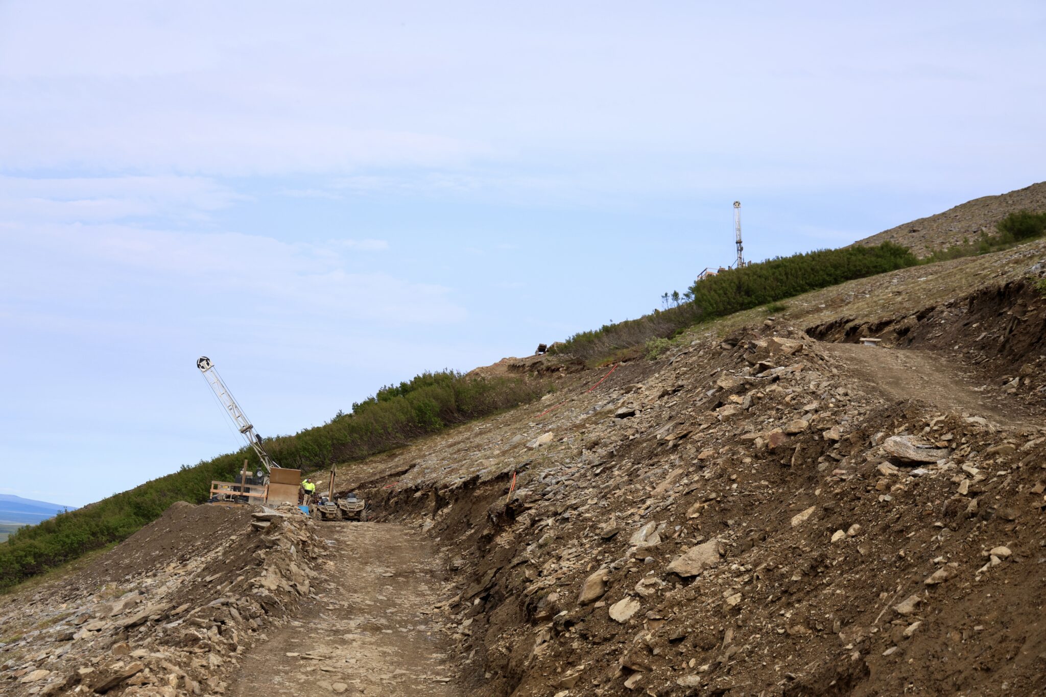 A drill pad carefully positioned on the side of the mountain. 