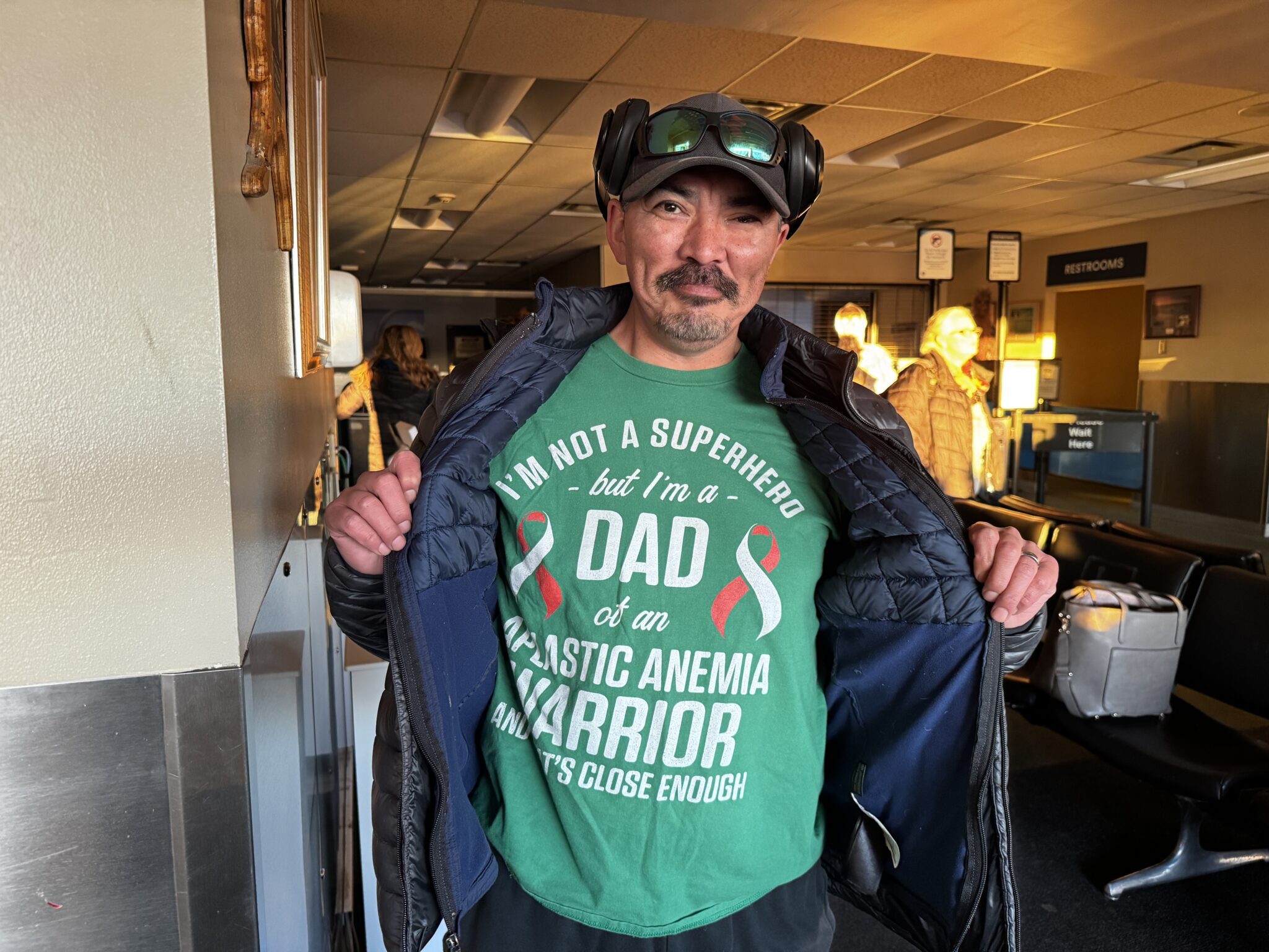 Owen Ningeulook's father, Christopher Ningeulook, shows off a t-shirt in support of his son. Ben Townsend photo.