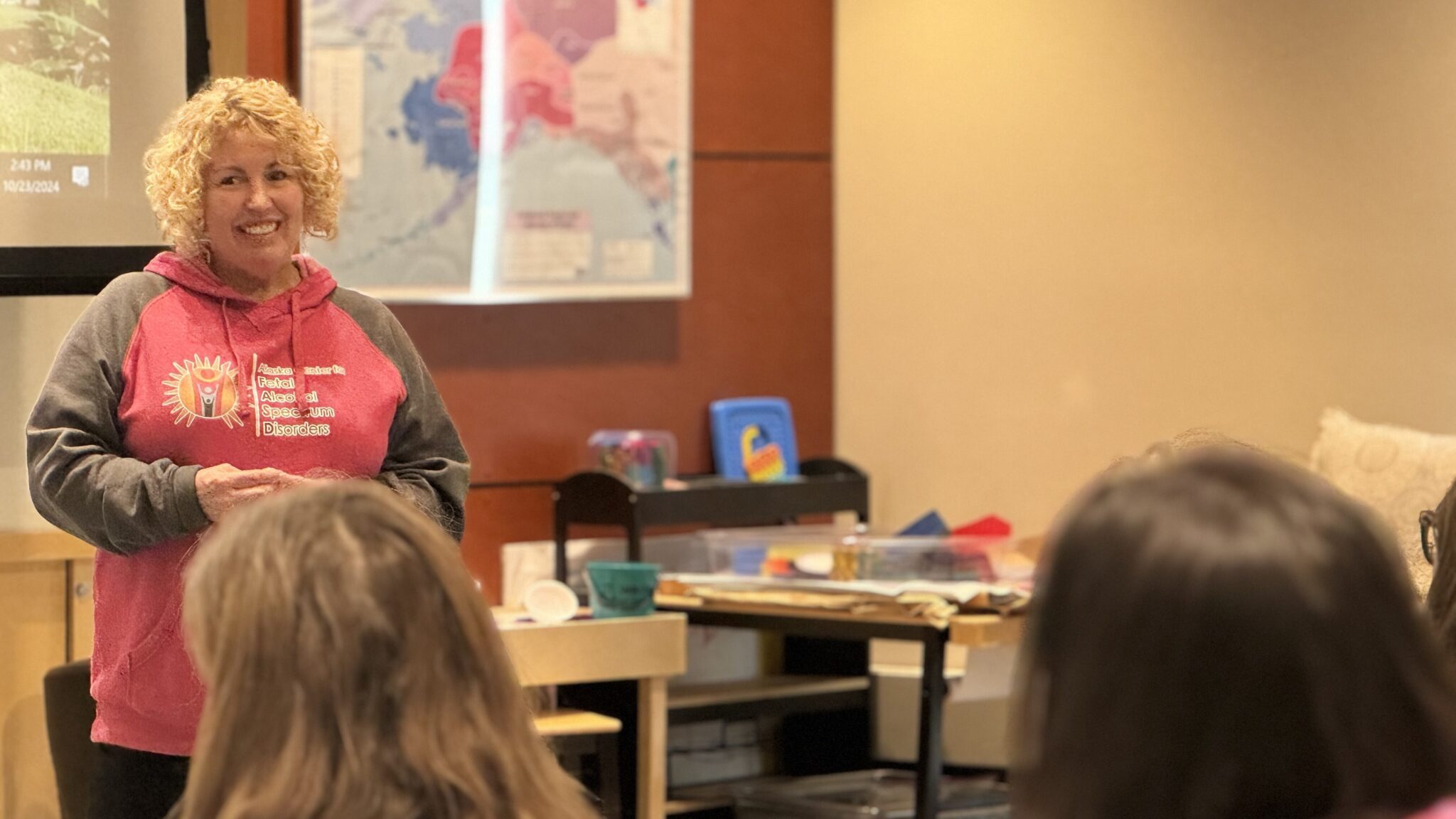 Gina Schumaker speaks to an audience at the documentary's showing in Nome. Sarah Swartz photo.