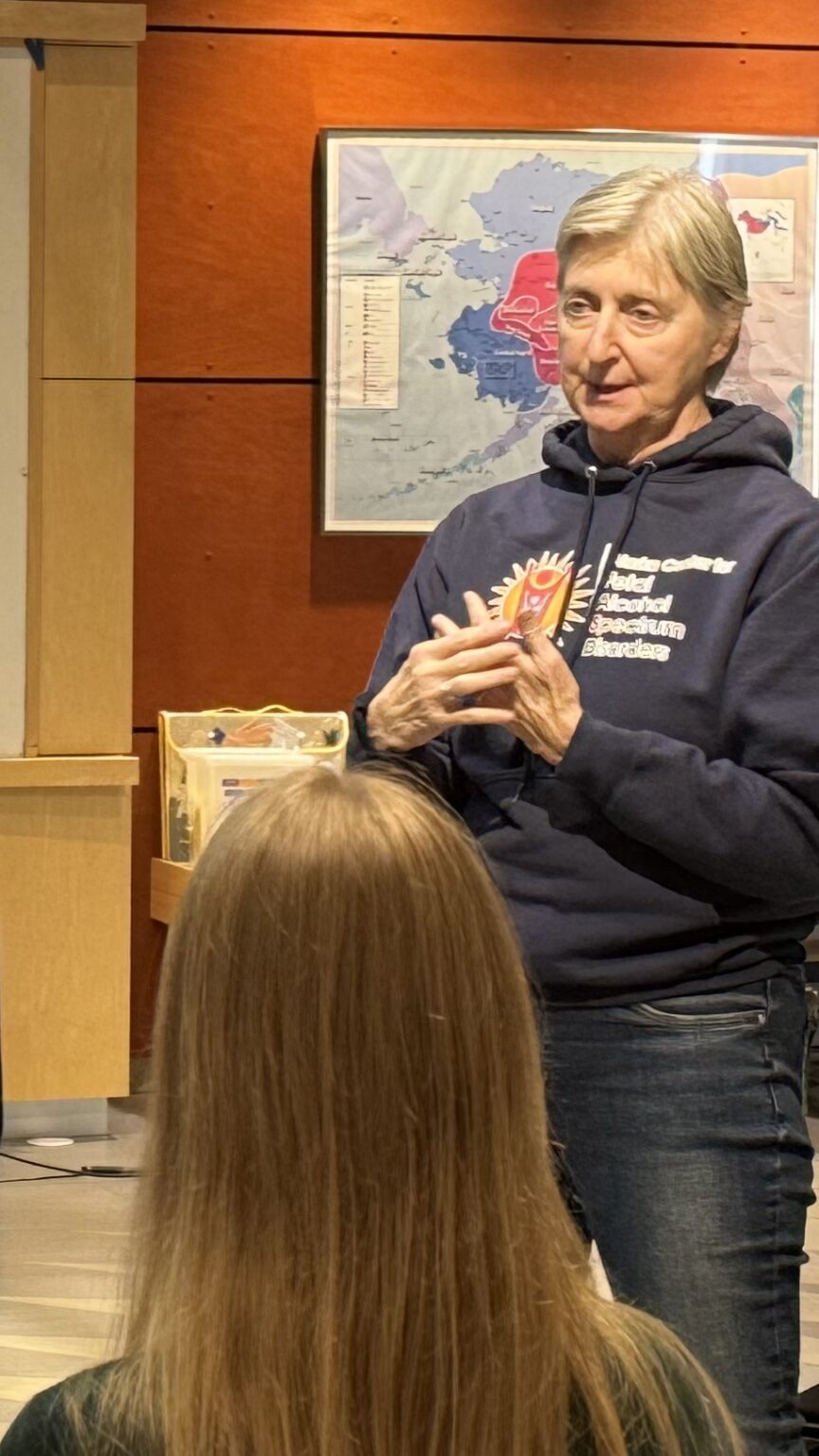 Janice Weiss speaks to an audience gathered at Nome's Katirvik Cultural Center. Sarah Swartz photo.