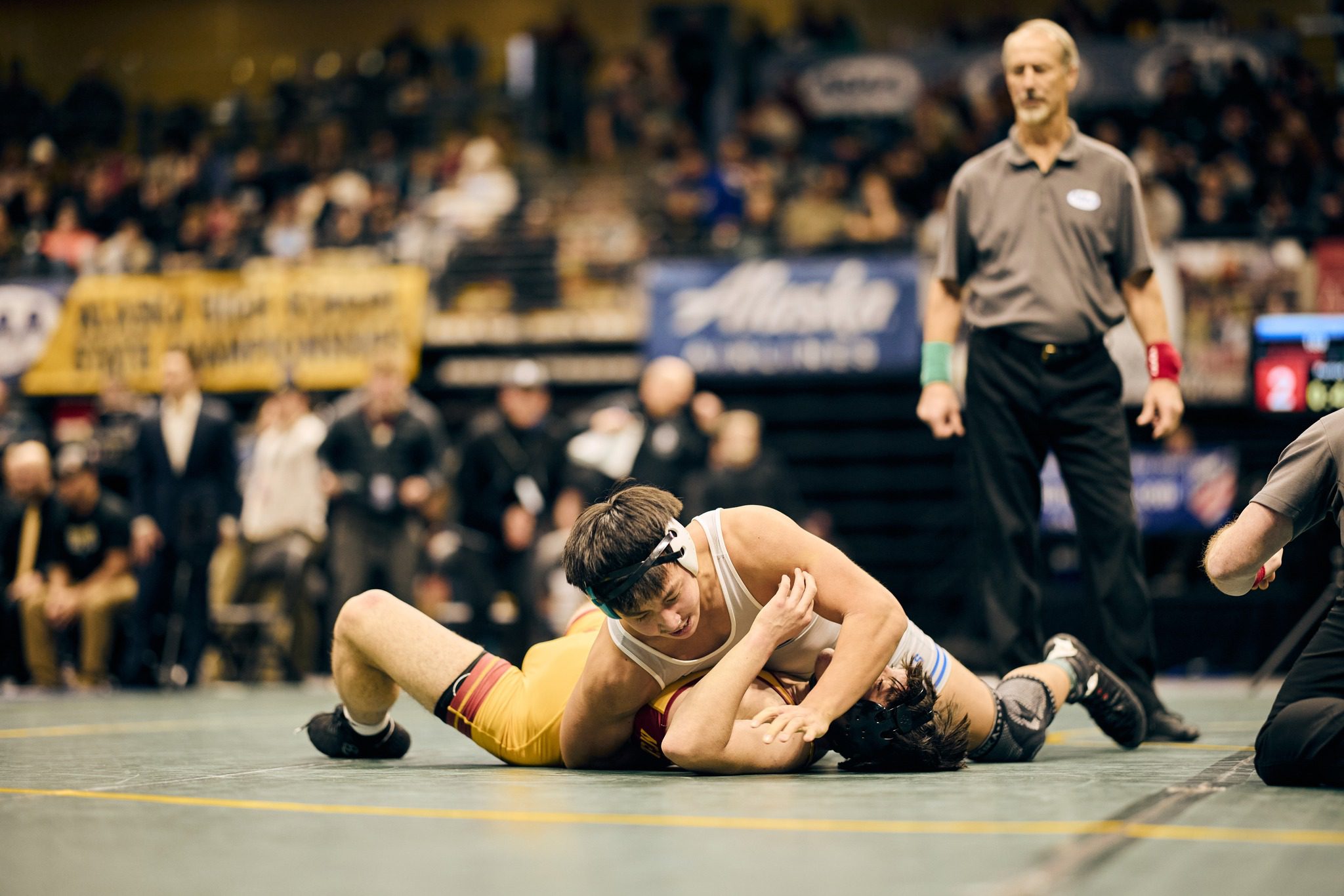 Wyatt Ahmasuk pins Mt. Edgecumbe’s Kaden Hermann at the Division II State Wrestling Championships. Photo courtesy of Junior Pikok. 