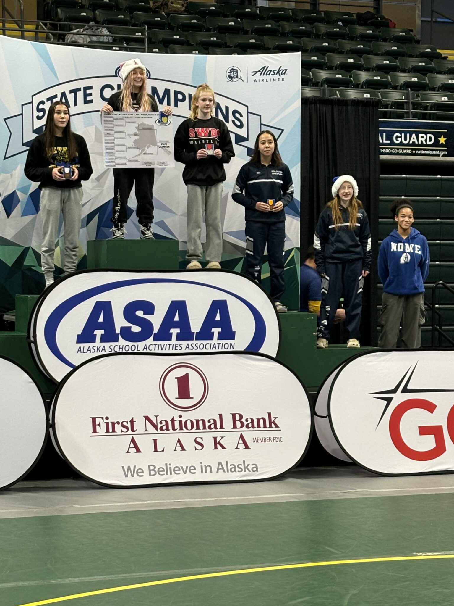 Renee Brown on the podium (first on the right). Photo courtesy of Corey Erikson. 