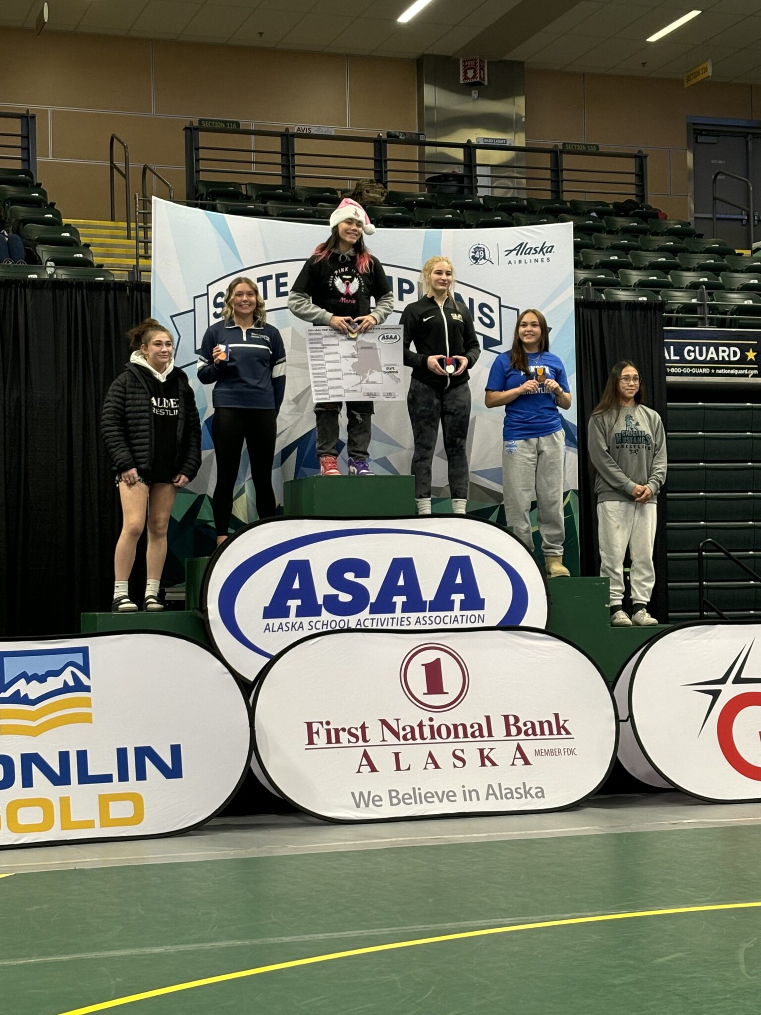 Lacey Sherman on the podium (second from right). Photo courtesy of Corey Erikson. 