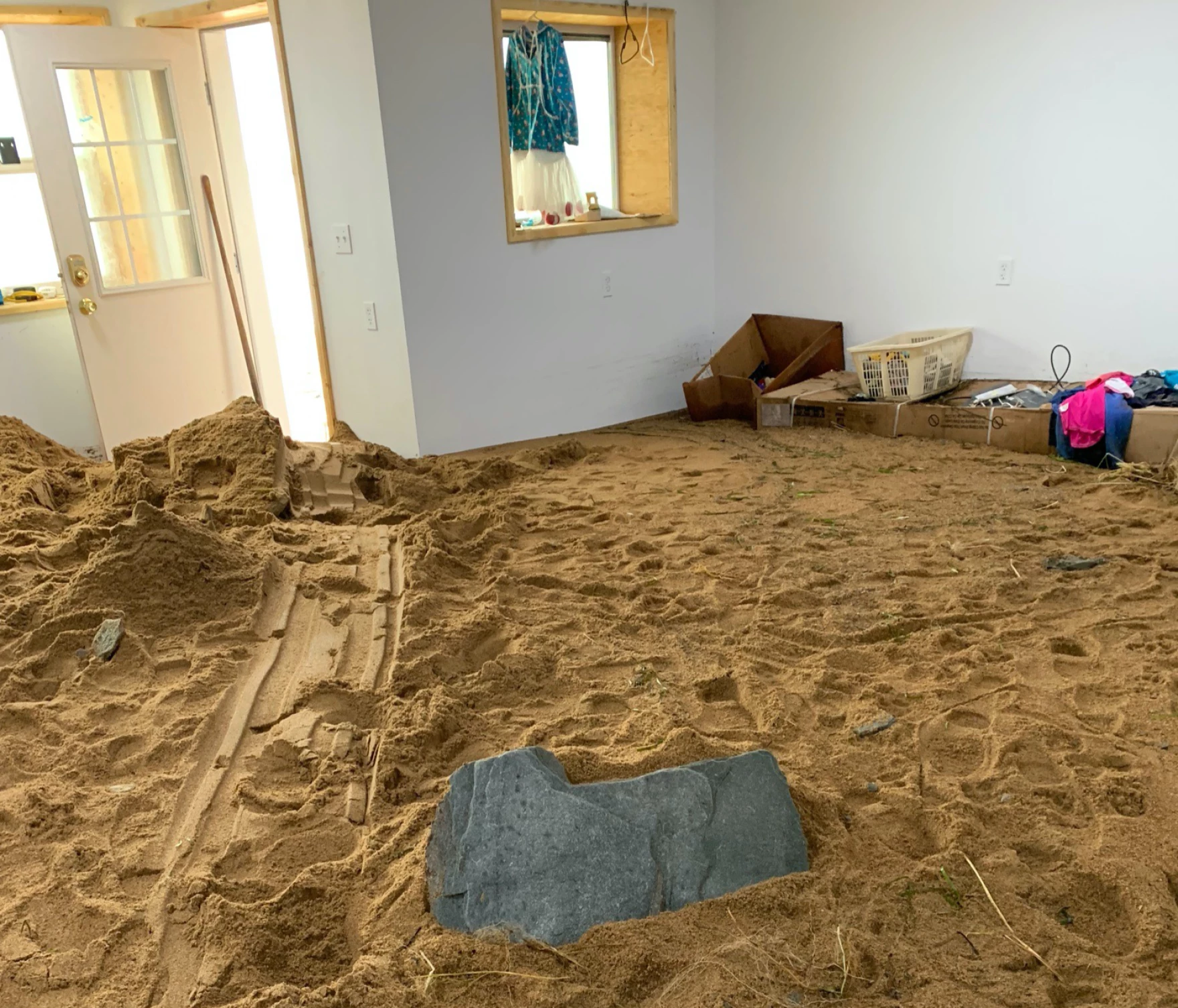 Sand fills the home of a Golovin resident following 2022's ex-Typhoon Merbok. "Inside my house is a sandbox," Golovin resident Willow Olson posted on Twitter. "If I don’t smile about this I will cry."
