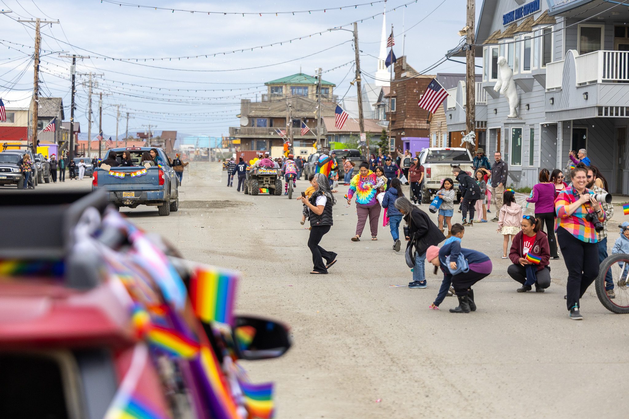 509428546_1307640997555310_2594205321502555300_n People line the sides of Front Street in Nome during the 2025 Midnight Sun parade. Ben Townsend photo.