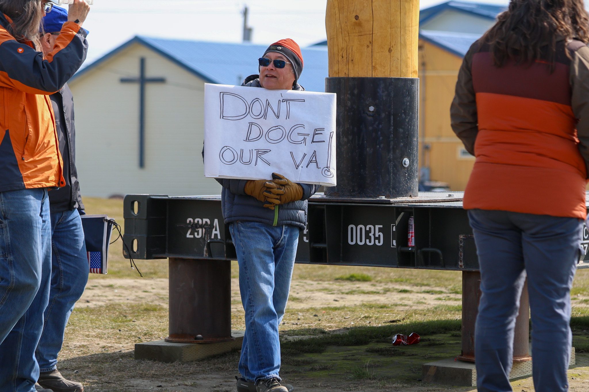 Bob Lewis Nome resident Bob Lewis holds a handmade sign. Wali Rana photo.