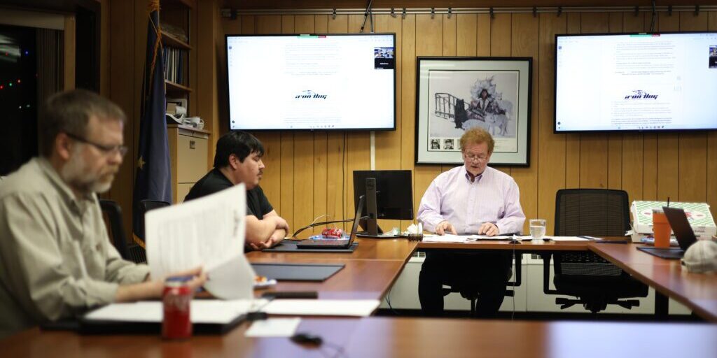 Mayor of Nome John Handeland reviews documents at a Nome Common Council meeting on November 25, 2024. Ben Townsend photo.