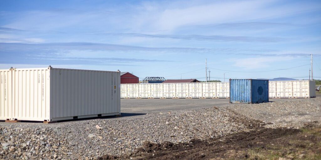 A blue shipping container between two rows of tan shipping containers at Burmeister Leasing & Landscaping, LLC's new self-storage facility. Ben Townsend photo.