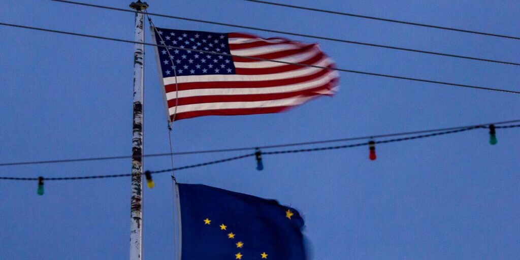 Winds over 60mph battered Nome's Front Street Tuesday night; the flags flying in front of Nome's Post Office were an unofficial measure of the wind strength. Photo by David Dodman.