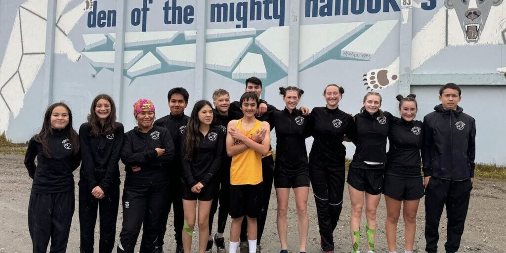 Unalakleet's cross country team poses for a photo outside of the Nome Beltz gym. Unalakleet School Facebook page. 