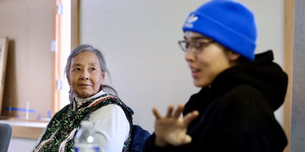 Annie Conger looks on as Martin Paul tells a story. Ben Townsend photo. 