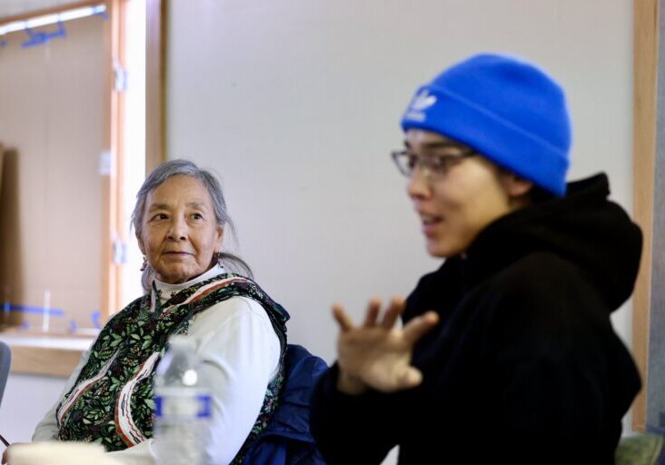 Annie Conger looks on as Martin Paul tells a story. Ben Townsend photo. 