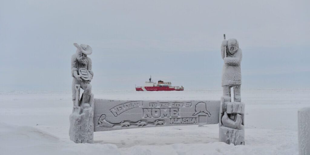 NOME, Alaska Ð The Coast Guard Cutter Healy breaks ice near the city of Nome Alaska Jan. 14, 2012. The Healy is breaking ice near Nome to assist the Russian tanker Renda move into final position for offloading nearly 1.3 million gallons of petroleum products to the city.  U.S. Coast Guard photo by Chief Petty Officer Kip Wadlow.