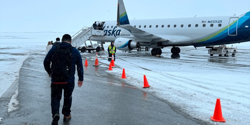 Passengers board an Alaska Air E175 passenger plane at the Nome Airport. Ben Townsend photo.