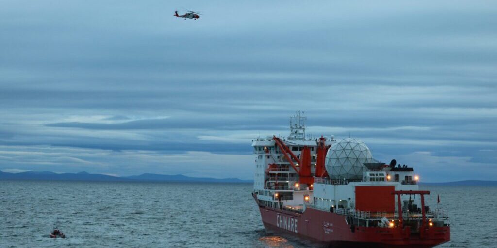 A smallboat crew from the Coast Guard Cutter Alex Haley medevacs a man suffering a broken arm from the Chinese research vessel Xue Long, 15 nautical miles from Nome, Alaska, Sept. 23, 2017. The smallboat crew embarked the man and transferred him to the Alex Haley for further transfer to Nome, Alaska. U.S. Coast Guard photo.