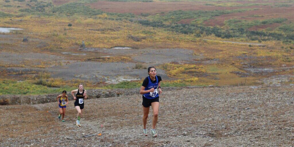 AwaLuk "Wookie" Nichols trudges up the side of Anvil Mountain during the Nome Classic Invitational. Rosa Wright photo.