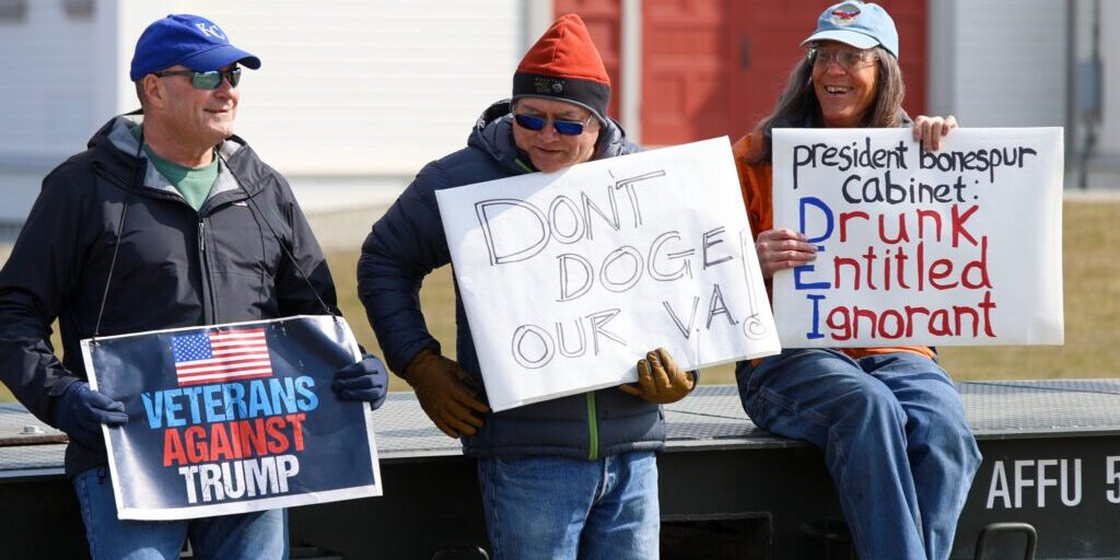 Nome residents John Bioff, Bob Lewis and Hannah Anderson protesting at Anvil City Square. Wali Rana photo.