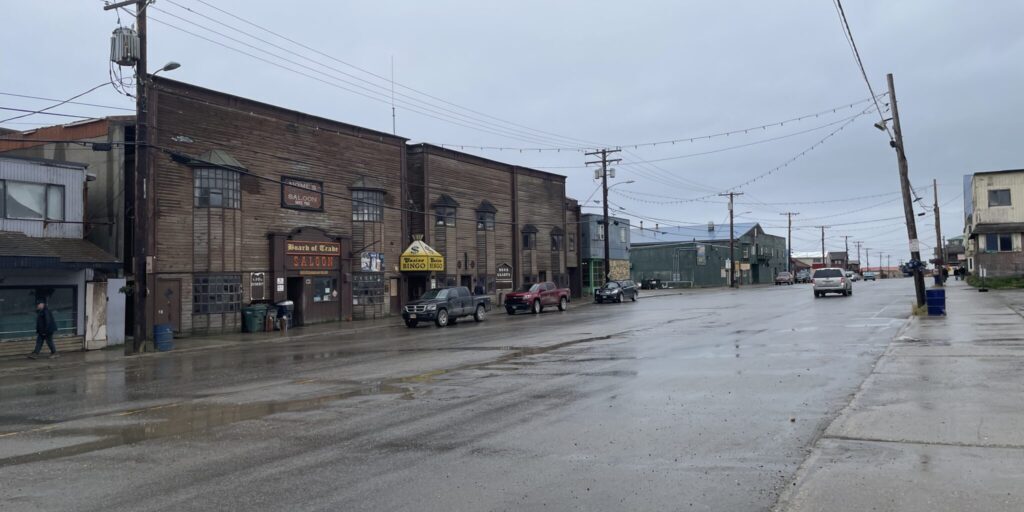 Fresh rain shimmers on the aging pavement of Front Street in Nome. Ben Townsend photo.