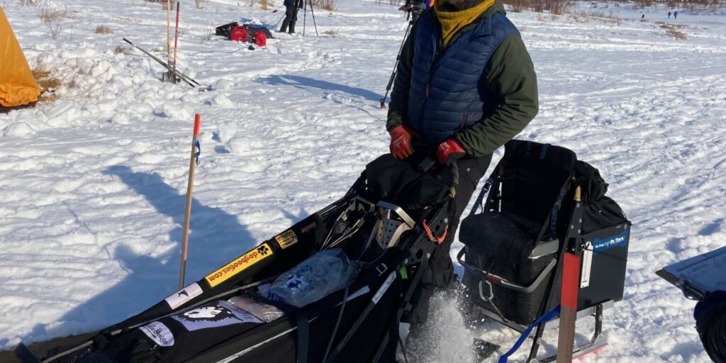 Brent Sass arrives in Iditarod on March 9, 2023. (Ben Matheson/AKPM)