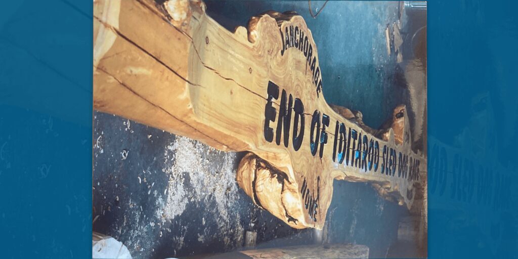 The completed Iditarod arch hand-carved by Bob Kuiper lays in his Sterling, Alaska workshop. Photo courtesy of Bob Kuiper.