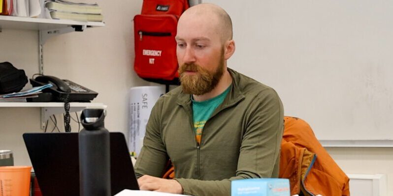 Keane Richards working in his classroom at the Anvil City Science Academy. Wali Rana photo.