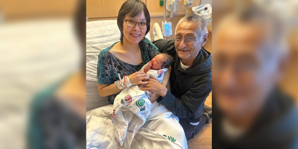 Danita Douglas and Dwayne Charles embrace their hours-old daughter Olga Margaret Douglas-Charles. Photo courtesy of Norton Sound Health Corporation.