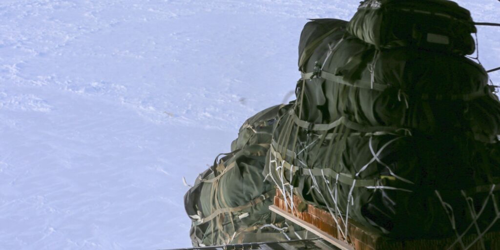 U.S. Navy equipment is air dropped from an Alaska Air National Guard C-17 Globemaster III transport aircraft crewed by members of the 249th Airlift Squadron to Ice Exercise 2018 participants on the frozen Beaufort Sea several hundred miles north of the Alaskan coastline March 2, 2018. This training is linked to the Alaska National Guard’s Arctic Eagle 2018 and U.S. Navy’s Ice Exercise. The U.S. Navy equipment being dropped was palletized by U.S. Marine Corps riggers from the 1st Air Delivery Platoon, Landing Support Company, Combat Logistics Regiment 17, 1st Marine Logistics Group. A number of Department of Defense exercises afford participating forces the opportunity to operate in a joint environment while assessing the ability to conduct sustained operations in arctic conditions including Arctic Eagle 2018, Alaskan Command’s Exercise Arctic Edge, the U.S. Army’s Arctic Pegasus, and the U.S. Navy’s ICEX. ICEX 2018 is a five-week exercise that allows the U.S. Navy to assess its operational readiness in the Arctic, increase experience in the region, advance understanding of the Arctic environment, and continue to develop relationships with other services, allies and partner organizations. The exercises occur in February and March 2018, and dates for each exercise varies. More than 50 Alaska Air and Army National Guardsmen are participating in both AE18 and ICEX. (U.S. Army National Guard photo by Staff Sgt. Balinda O’Neal Dresel)