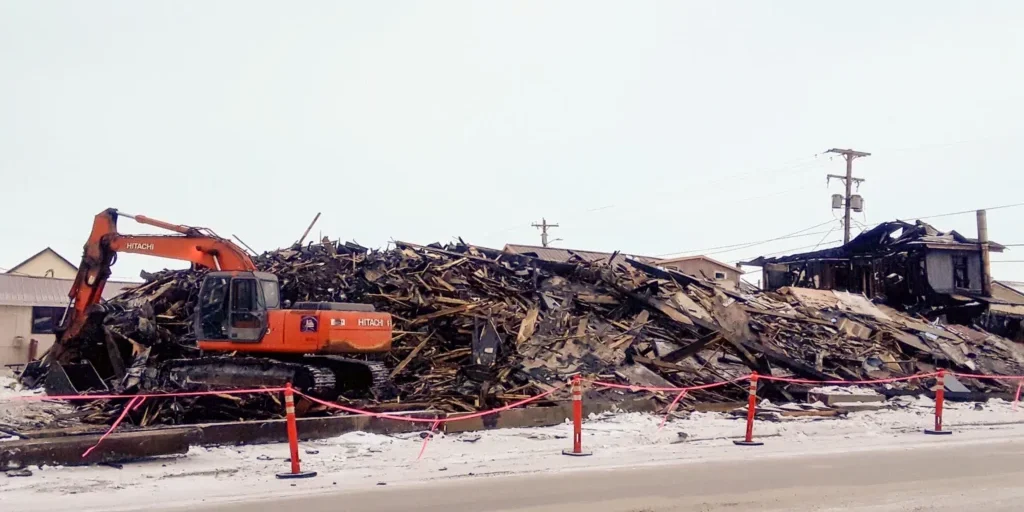 What remains of the Polaris is being demolished and removed by Q Trucking. Photo Credit: Davis Hovey, KNOM (2017)