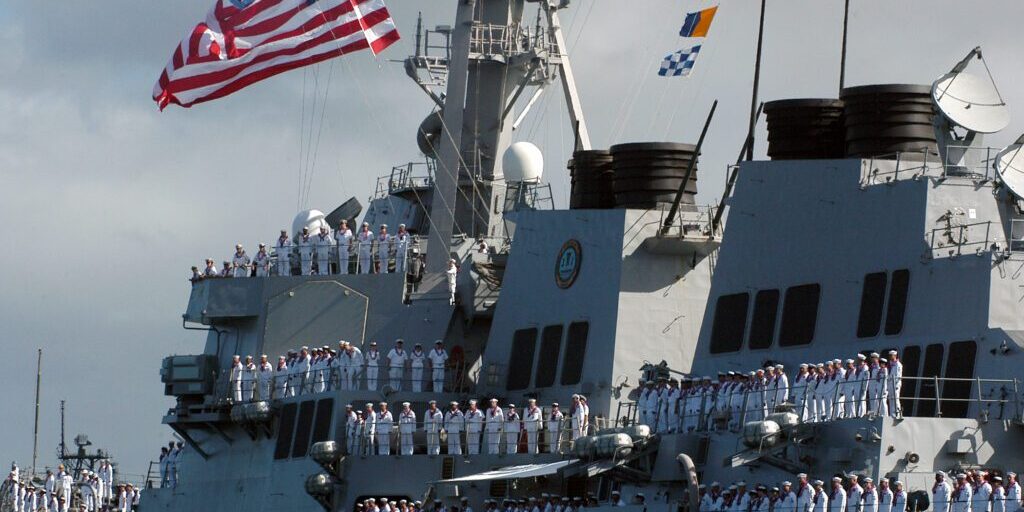 050729-N-3019M-004
Pearl Harbor, Hawaii (July 29, 2005) - Sailors man the rails aboard the guided missile destroyer USS OÕKane (DDG 77) as the ship returns to Pearl Harbor from a six-month deployment. OÕKane deployed as part of the Carl Vinson Carrier Strike Group in support of the global war on terrorism. U.S. Navy photo by Journalist 3rd Class Ryan C. McGinley (RELEASED)