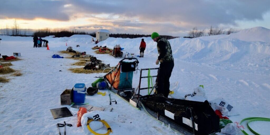 Kelly Maixner's team rests on their 24-hour break at the checkpoint in McGrath on March 8, 2023. (Ben Matheson/AKPM)